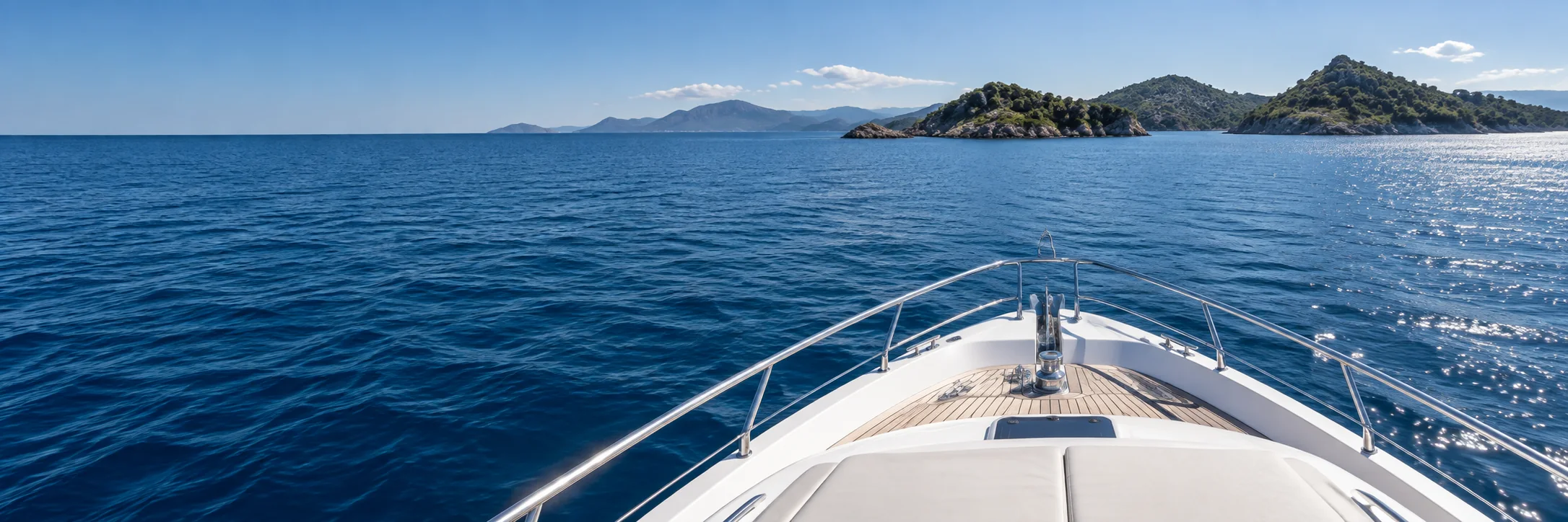 View from a motor yacht travelling across open coastal water